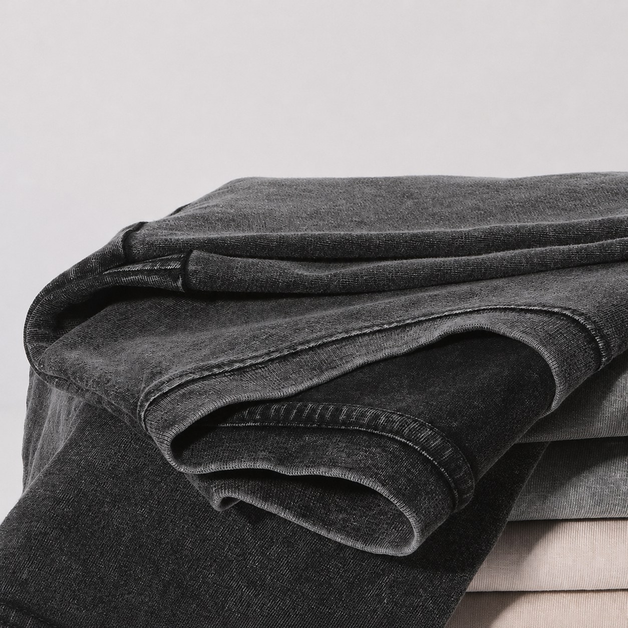 Folded vintage washed cotton T-shirt fabric stack